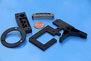 small milled black parts